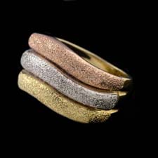 Tri-color sparkle texture ring.  This ring is made in 18kt gold amd is 8mm in width.