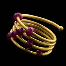 Ruby Spring Ring from Gurhan. Faceted ruby beads on a coiled adjust-to-fit design from size 6.5 to 8.5, 3.01ctw.