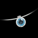 Slide pendant by Bastian Inverun. The pendant features a circular cut blue topaz bezel set and suspended from a omega snake style chain with lobster claw clasp.