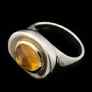 Sterling silver with 18kt. yellow gold bezel ''Riverstone'' ring with oval Citrine. This ring is designed by Robert Lee Morris and is a size 6.25. The top measurements are 7.8mm in width by 9.57mm in length 3.3mm in height.