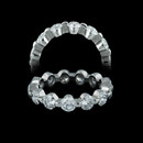 This is a Memoire .999 pure platinum single shared prong diamond eternity wedding ring and is the finest one made. The ring is set with 3.25ct of SI G ideal cut diamonds and is 4.2mm in width. Available in many different diamond weights. If you ever lose a diamond out of this ring we replace it free!  It's that solid.