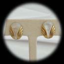 A nice deco designed mother of pearl and 14kr pierced clip earrings.  The pieces measure 18mm x 12mm.  