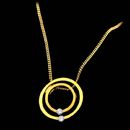 18kt yellow gold circle in a circle diamond pendant by Sakamoto.The price is only for the pendant. 