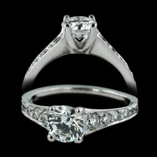 Set in platinum, a 3/4 carat center diamond (not included) sits strikingly atop two rows of side diamonds. Total weight is .36 carats.