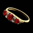 Get the royal treatment with this Charles Green regal 18kt yellow gold Victorian style engagement ring. The ring is embellished with 1.00ct of rubies and .08ct of diamonds.