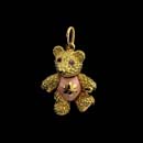  A very cute 18kt. gold baby bear with pink enameled tummy and pink sapphire eyes. Head, arms, and legs move. 7/8'' tall with gold belly. 