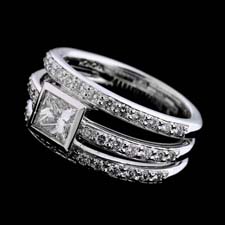 Honora 18kt white gold three band pave ring set with .66ctw in pave and a .67ct princess center diamond.