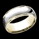 A masculine 14k gold two tone mens wedding band. This ring features 14k white gold in the center with 14k yellow gold along the edges. The ring combines classic and contemporary gold design. The price is for a size 10, but this ring can be made in other sizes. The price will vary depending on finger size.