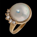Item 070EJ1 - Here is a beautiful 14kt yellow gold, diamond, and mabe pearl ring. The ring is set with five full cut diamonds and one lustrous 12.8mm mabe pearl. Finger Size 6

