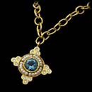 Cathy Carmendy 20kt. gold, seed pearl, and aquamarine pendant on a handmade chain.