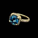 SeidenGang green gold ring with diamonds. The ring is set with a 10mm cushion cut light blue topaz and is accented with .52ctw in diamonds.