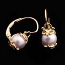 Wow, luxurious 20kt gold and pearl earrings from designer Cathy Carmendy. These  earrings are set with 7mm pearls. The earrings have lever backs. 