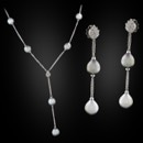 18kt white gold Damiani Tahitian pearl and diamond necklace and matching earrings. The pearls are a natural grey/black color measuring from 10.5mm to 12.0mm. These are sold as a set only and are one of a kind no re-orders.  The earrings and "Y" necklace is set with 1.0ct of VVS E-F quality diamonds. Necklace is 23 inches in length and earrings are 2 3/8 inches.  Handmade in Italy. When we moved 5 years ago we found these boxed up and never displayed. Very fine set. Original price $24,500.00