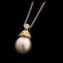 10mm White south sea pearl pendant with .35cts of diamonds set in 18kt yellow gold suspended from an 18kt yellow gold chain.