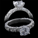 Stylized hearts define the styling in this 18 karat white gold engagement ring by Harout R. The center diamond is 1.00 carats, however the ring can accommodate center diamonds from 0.75 carats to 2.00 carats. The additional side diamonds weigh 0.24 carats in total. The pricing does not include the center diamond. 