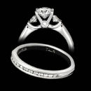 A classic Scott Kay platinum engagement ring featuring hand engraving and 0.64ctw in diamonds.  The matching wedding band has 0.26ctw in diamonds and retails for $3150.00.