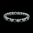 This is an 18k diamond and blue sapphire eternity wedding band from Beverley K.  The band is made up of .34ctw of bezel set diamonds and .41ctw of bezel set sapphires.