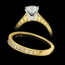 This 19 kt. yellow gold engagement ring with platinum center comes with hand engraving. The ring is set with 0.29ctw in diamonds. The center diamond is not included in the pricing.  The matching wedding band has 0.15ctw diamonds and retails $2,180.00.
