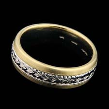 Classic Michael Beaudry gent's platinum and 18k yellow gold wedding band, with engraved detailing in the center. 6 1/2mm width. Please call for current pricing information.