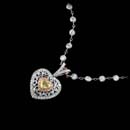 A wonderful handmade platinum necklace designed.  This piece contains .72ctw of fancy yellow, pink and white diamonds.  Chain sold seperately. Call for price and availability.
