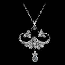 This gorgeous <i>Fleur de Lys</i> pendant shines with over a half a carat in diamonds.