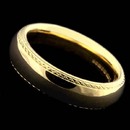 Charles Green's 18kt yellow gold hand engraved, engraved edge wedding band. The ring is a 6mm comfort fit.  Very nice very heavy.  Handmade die struck ring simply the best made.  We've carried this ring since 1930 and it's still our best selling wedding band.  Available in platinum.