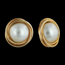 Twisted wires of 14kt yellow gold surround one each 11mm mabe' pearl earring.  These earrings have a post back.
