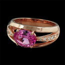 This beautiful warm 18kt rose gold Baby Luna ring by Gumuchian is set with a vivid pink sapphire.  Along the side are pave' set diamonds weighing .18ct. total weight. The sapphire weighs 1.94ct and measures 8mm in width. 