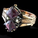 A 1890's circa 9kt yellow gold Victorian era garnet and seed pearl ring.  Ex condition.  The ring is a size 5 1/4 and measures 14mm north to south.  We do not see many rings this old in this condition
