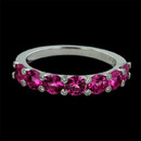 Gumuchian Ring 129J1: This platinum twinset band by Gumuchian contains seven very bright and lively pink sapphires weighing a total of 1.67ct. Set on top of each prong is a bezel set diamond. This ring measures 3.5m wide and can easily be worn separate or with another ring. This ring is also available in 18kt white gold. Gumuchian Ring 129J1 jewelry