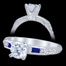 A gorgeous Edwardian style 14k white gold engagement ring that showcases 2 channel set baguette shape blue sapphires. The sapphires have a carat weight of 0.15. 2 channel-set round diamonds, finshed with beautifully hand cut engraving. Price does not include center diamond. Made in America.