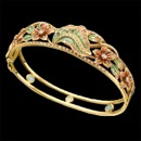 A beautiful enamel and diamond bracelet with a gorgeous art nouveau inspired design. This bracelet is made from solid 18k yellow gold. There are 56 diamonds placed throughout this bracelet, with a total carat weight of 0.58tcw. The size of the bracelet measures 17mm by 180mm. The enamel leafs feature green and red with a gradient of yellow from the gold.