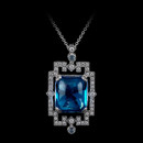 This artfully designed pendant features a 20.18ct blue topaz, iconically framed by .67ctw of diamonds, hand-set in 18k white gold.
