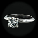Item 130PO1 - This piece features an AGS Ideal certified Triple 0 round full cut brilliant diamond. The stone's color is D, with VS2 clarity, and weighs .68cts. The stone is set in a platinum four prong head, dome shaped 14kt white gold shank setting, with finger size 3 3/8. The stone is hearts and arrows.