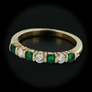 Item 135CO1 - This gorgeous Jeff Cooper 18kt yellow gold band is set with .34cts of emeralds and .21cts of diamonds. With a thickness of 3.5mm and a size of 6 3/8.