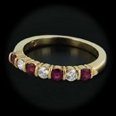 Item 136CO1 - This gorgeous Jeff Cooper 18kt yellow gold band is set with .34cts of rubies and .21cts of diamonds. With a thickness of 3.5mm and a size of 6 3/8.