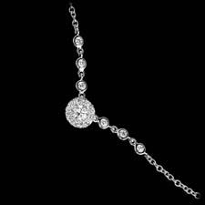 A wonderful 18kt white gold "princess" necklace by Peter Storm.
This piece contains .42ctw of beautiful diamonds. The cluster measures 7.0mm and the piece is 16 inches in length