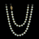 This opera length pearl strand to measure 30 inches, features alternating 6 mm pearls, and 3.25 mm 14kt yellow gold discs. The piece is finished with a beautiful yellow gold clasp.