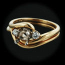Item 154CO1 - A set of 18kt gold wedding rings by Jabel. The mounting is set with 2 .05ct (.10ct tw) of diamonds of VS F-G quality. The center stone should be 1/2ct. Size 6 1/4.