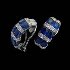 These beautiful 18k white gold huggy earrings are striped with 4.75cts. in sapphires and .65cts. in diamonds.