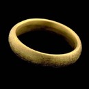 A 5.5mm 18kt yellow gold ring by Christian Bauer. Available in fiberglass finish, rock finish or bright polish.