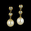 Item 166CO2 - These beautiful South Sea pearls measure 9.5mm in diameter and are suspended in an 18kt yellow gold setting with two bezel set diamonds in each earring.  There is a total diamond weight of .32ct. The earrings dangle 1 inch in length.