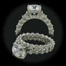 Item 178PO1 -  A beautiful, excellent condition Ritani single prong bridal set. The engagement ring and wedding band are platinum and feature diamonds set all the way around the shank. Size 4.75
