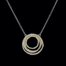 Unique multi-circle pendant 'kissed' with 24k gold. This chain is adjustable from 16-18 inches. Pendant is 27mm wide.   