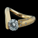 This Steven Kretchmer yellow gold V engagement ring is shown with 8 full cut melee diamonds. This mounting as shown is for 0.50 carats to 1.00 carat center diamond. Also available for diamonds from 1.01 carats to 3.00 carats in size. Please call for these additional sizes. The ring is available in platinum, white gold, and rose gold as well. The center diamond is not included in the pricing.