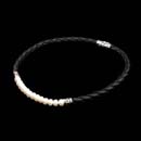 Honora Necklace 99Z3: Classic simplicity: Honora braided black leather choker accentuates a row of cultured pearls. Sterling silver accents and clasp. Matching bracelet available. Honora Necklace 99Z3 jewelry