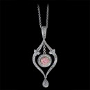 A very rare one of a kind natural orangy pink diamond and platinum pendant from Bridget Durnell. This is a handmade piece set with 1.15ct of white E-F colored VVS ideal cut diamonds. Floating freely in the center is a certified .34ct SI1 round orangy pink diamond. Now this is one pretty piece. 1 3/4" x 3/4" with a platinum 16" chain.