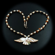 A gorgeous abalone and tiger eye shell necklace. The chain measures 18 long and the bird pendant measures 2 13/16