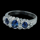 Oval 3 stone sapphire ring from Spark set in 18k gold. Set with 0.26ct in diamonds and 1.04 carats in sapphires 
