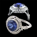 A truly stunning 18K antique style ladies Beverley K engagement ring. The center blue sapphire is bezel set and surrounded by a gorgeous sapphire and diamond halo. There is a diamond shaped design underneath the center stone. A vintage art deco inspired design. This ring is also available in platinum. The center stone can be anything you would like; just image a diamond instead of a sapphire. Like with all Beverley K pieces; this ring can be made is yellow and rose gold. A stunning work of art that captures the art deco design period, the photos do not do the ring justice.